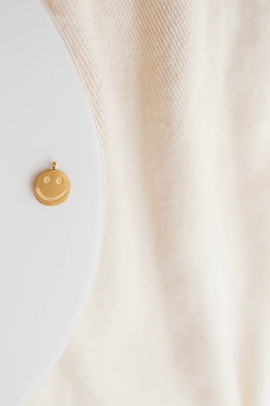 THE GOLD SMILEY FACE