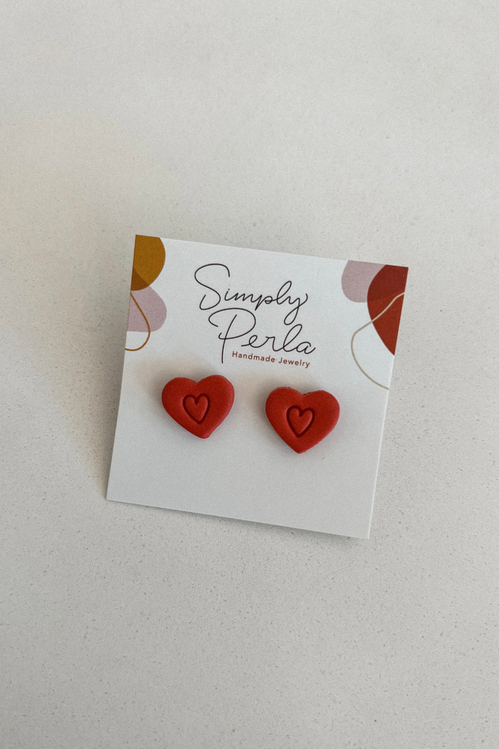 RED DOUBLE HEART STUD EARRINGS